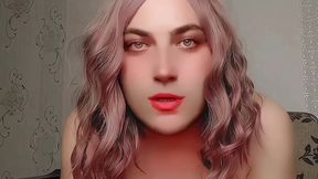 Playful sissy sitting sideways on big fluffy chair