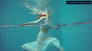 Redhead Diana hot and horny in a white dress