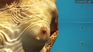 French model enjoys herself underwater
