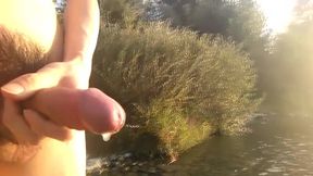 Twink wanks his hairy dick in public streams cum rivers