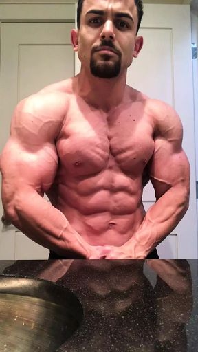 Jacked bodybuilder Benji Bastian flexing his huge, shredded, muscles