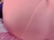 Sexy sissy crossdresser femboy in a pink pantyhose on the bed.