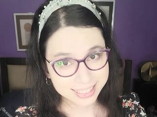 Marvelous lil shemale DaniTheCutie holds a thick sex toy in her constricted booty this Christmas