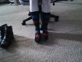 Becky putting on socks and Harley boots