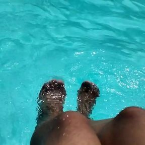 Feet in the pool with a lot of water