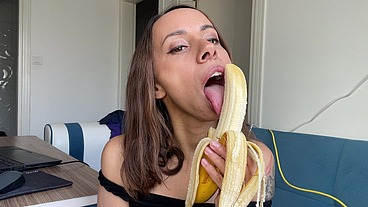 Dirty horny brunette sucking banana