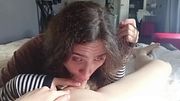 Puppy licks its owner's feet