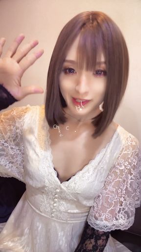 A video of a beautiful cross-dresser with bob hair quietly masturbating.