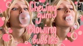 Cute girl chewing gum and blowing bubbles II