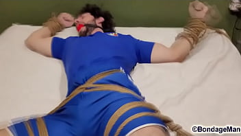 Henry is a super famous brazilian model in bondage for the first time bound and gagged moaning for escape