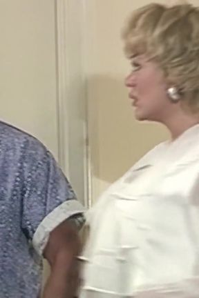 MILF relaxes with a bikini on while the guard watches