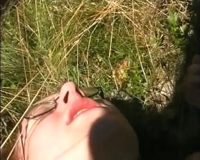 Amazing redhead with small tits masturbates her wet pussy with a dildo outdoors