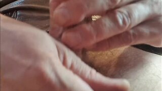 Masturbating in a leather jacket in daylight bathroom