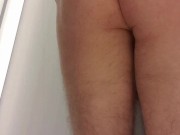 Femboy tries on women's blouse and skirt in store fitting room
