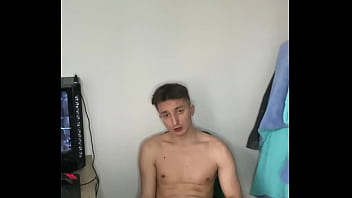 Twink watches adult movies and jerks off his big cock