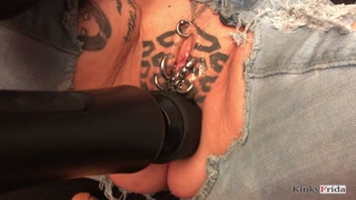 KinkyFrida in jeans plays with her pierced and tattooed pussy