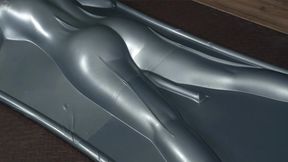 Flogging in a gray latex bed upside down with vibro and eyes closed