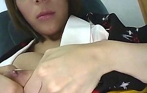 Asian ladyboy plays with dildo