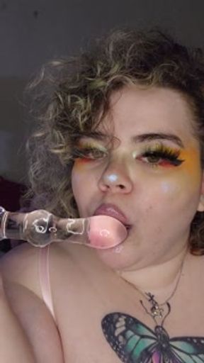 Goth GF sucks on toy for you