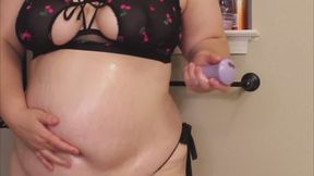 Baby oil all over my large belly while I slap and play with my belly button with my fingers and vibrator