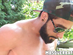 Zack is bearded muscular biker who is jerking off outdoors