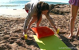 Eager brunette gets wrecked on the beach