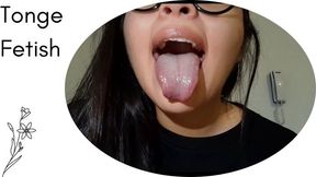 My tongue in the foreground, drooling and touching my chin (custom)