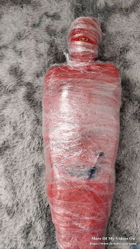 NANA Mummified with red plastic tape and then played with for orgasms