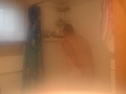Getting cleaned up in the shower after getting very muddy and dirty