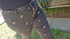 very rare and expensive jeans pierced by a rusty nail