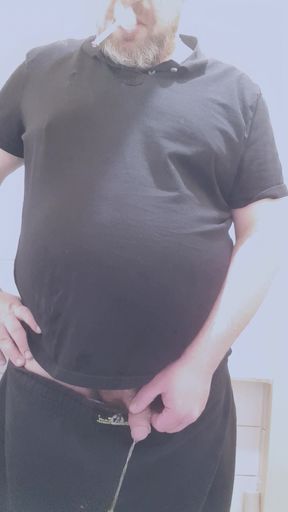 bear smoking and taking a long piss