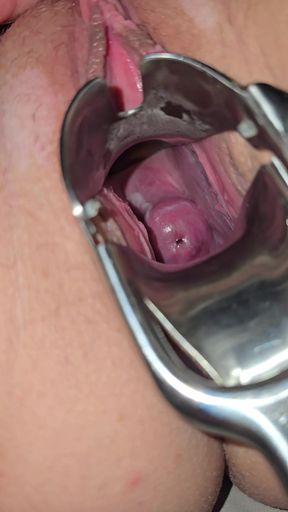 Milf inspects her pussy and inserts speculum to see inside