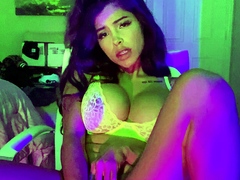 Busty babe playing with her big boobs