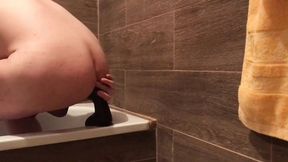 Masked sissy fucks BBC in a bathroom