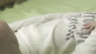 Tiny Japanese babe moistens her panties with pussy juices