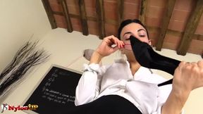Watch this hot teacher dominate with her huge strapon while stroking her perfect feet in stockings