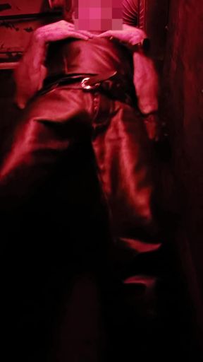 I show you my leather bulge in the corner of the darkroom, and then pull out my hard cock for you.