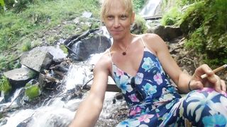 Alexa Cosmic swimming in cool waterfall dressed in colorific combi sundress...