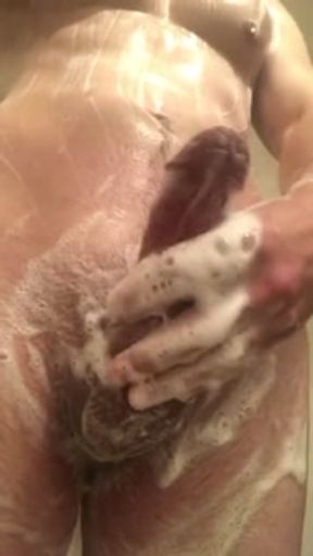 Athletic frat boy showers and beats off soapy cock