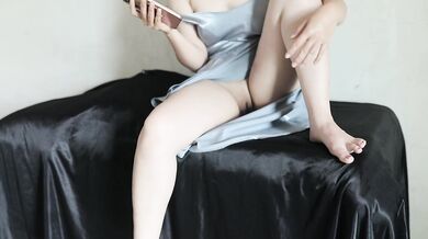 Indonesian girl in satin dress masturbates with a plump butt