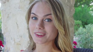 A girl with a wonderful body is playing with her natural tits