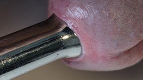 Pulling out extremely tight 14mm urethral teardrop plug close-up.
