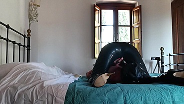 Wearing a latex condom catsuit and high heels ankle boots i have to suck a big cock and swallow cum