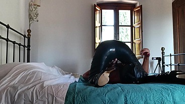 Wearing a latex condom catsuit and high heels ankle boots i have to suck a big cock and swallow cum