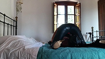 Wearing a latex condom catsuit and high heels ankle boots i have to suck a big cock and swallow cum