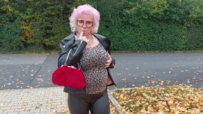 Naughty Granny Tongue Out Flashing Big Tits in Public