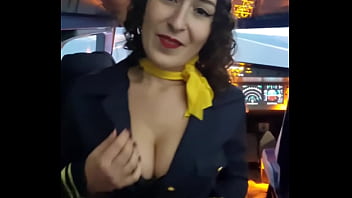 The flight attendant puts a dildo in her pussy on board