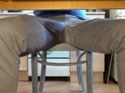 Pissing in jeans under the table