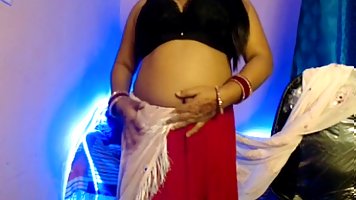 Amateur chubby Indian MILF with huge tits posing on camera
