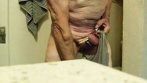 self spanking using studded riding crop. slapping balls legs stomach and chest while wearing chastity cage.